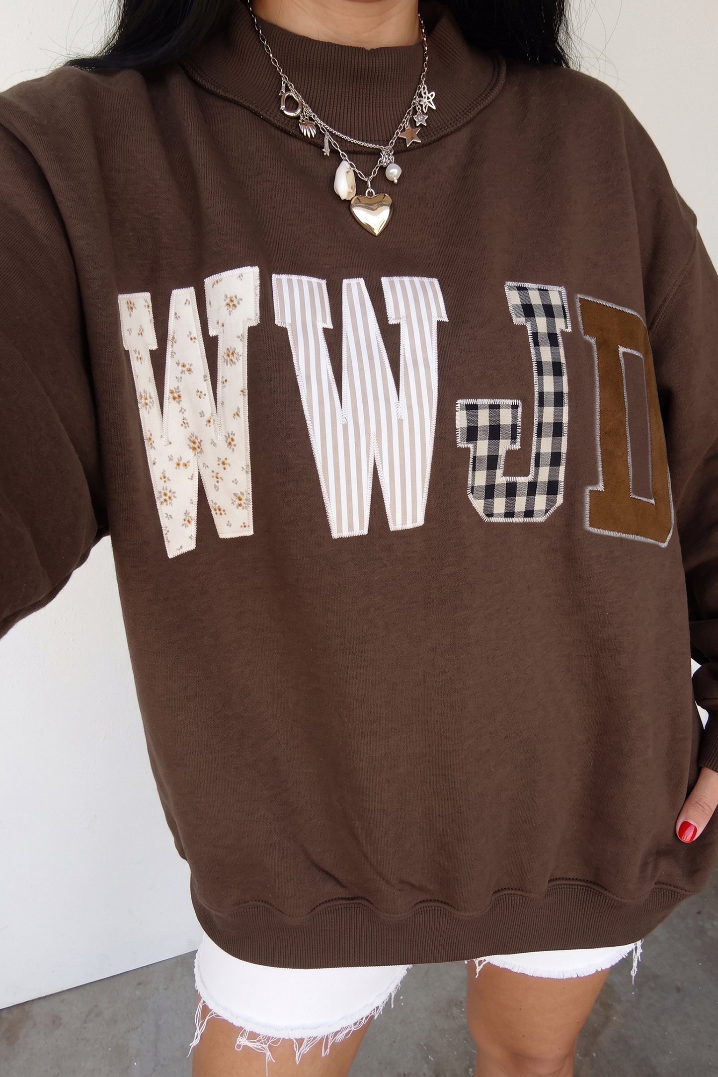 Bonbon WWJD Mixed Pattern Embroidered Patch Graphic Mock Neck Sweatshirt