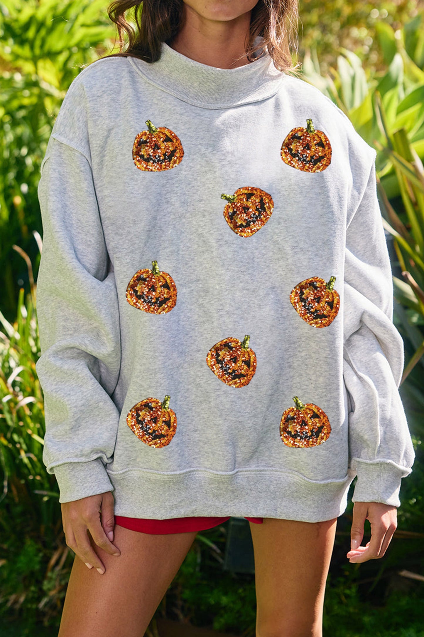 Light Grey Sequined Halloween Pumpkin Graphic Exposed Seam Mock Neck Sweatshirt